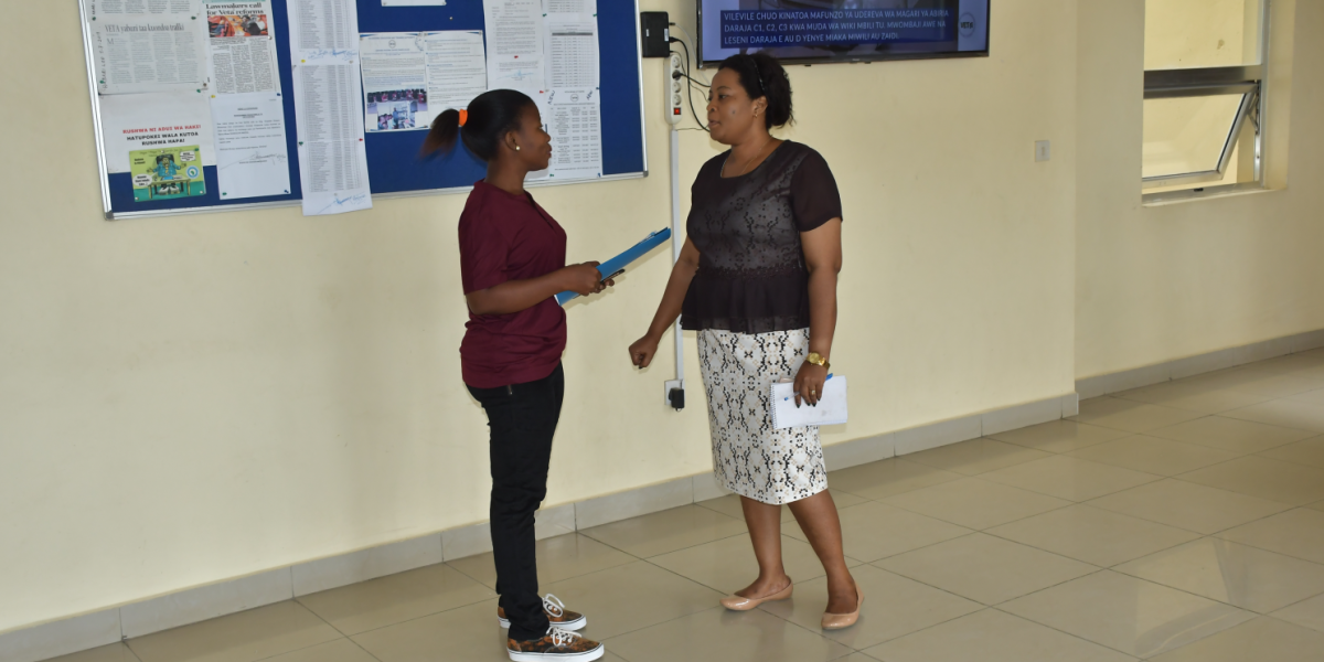Acting Registrar Interacting with Assistant ESCO