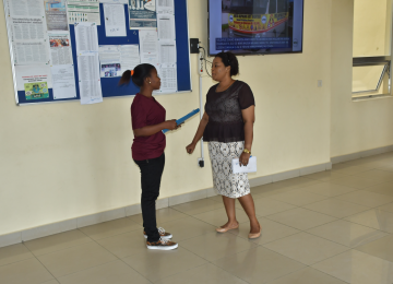 Acting Registrar Interacting with Assistant ESCO