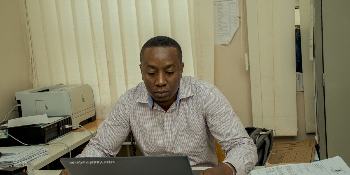 Accountant of Veta Kipawa On His Computer
