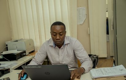 Accountant of Veta Kipawa On His Computer