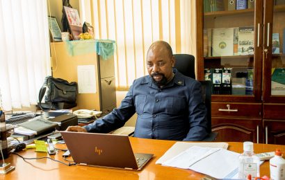 Principal in his office