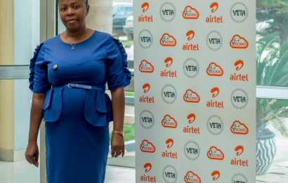 Head of Records Department Posing Next to VSOMO Board