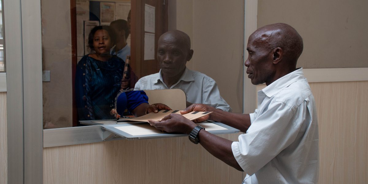 Estate Officer Handing over a File to the Head of Records Department