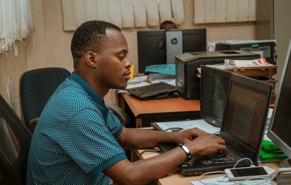 ICT Officer Reading Work Emails