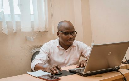 I.T Tutor Typing a Quiz for his students